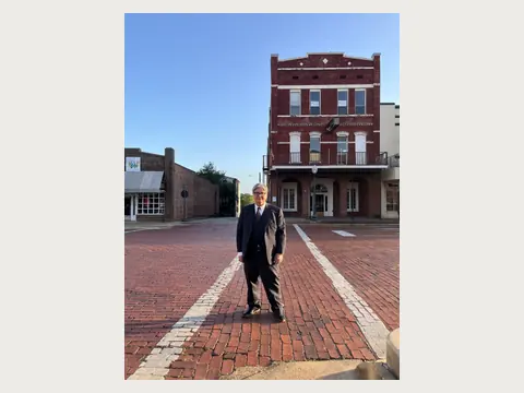 Herbert Midgley walking on the historic brick streets of Nacogdoches.