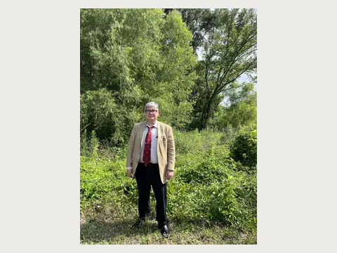 Herbert Midgley standing outdoors in East Texas.