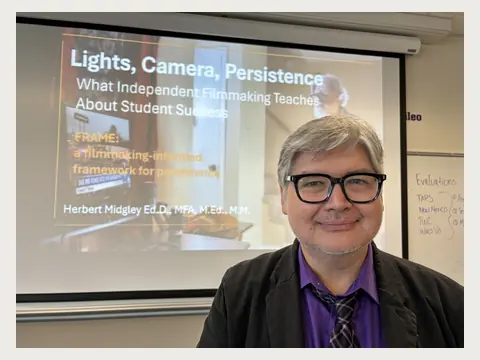 Herbert Midgley presenting Lights, Camera, Persistence.
