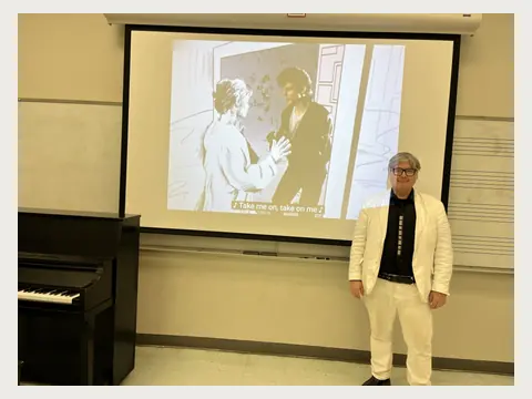 Herbert Midgley teaching in a university classroom.