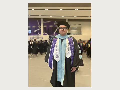 Herbert Midgley in doctoral regalia.