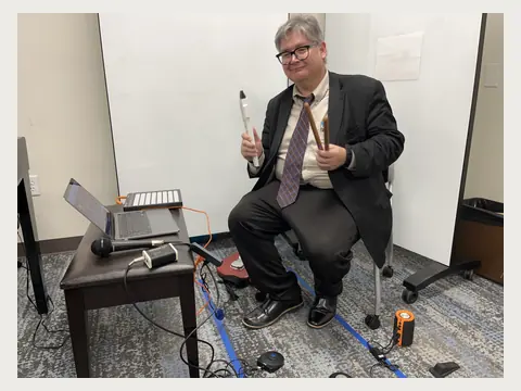Herbert Midgley demonstrating electronic music equipment.