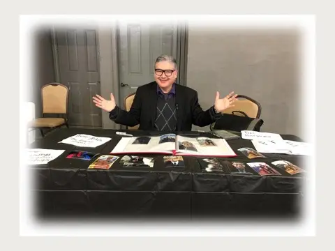Herbert Midgley presenting film and media work at an event.