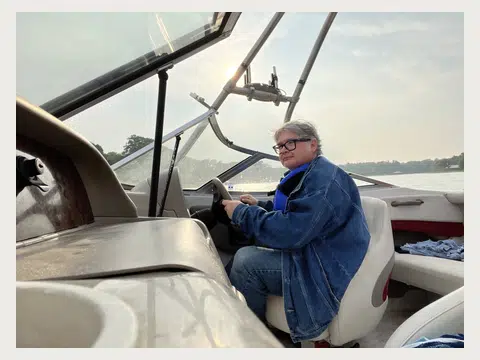 Herbert Midgley seated in an aircraft cockpit.
